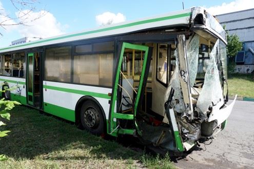 damaged city bus after crash